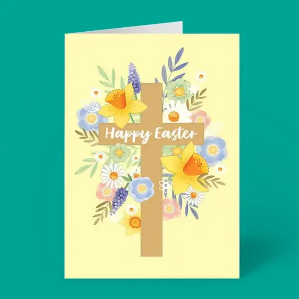 An Easter card featuring a floral cross design with yellow daffodils, pastel flowers and the text Happy Easter on a soft yellow background.